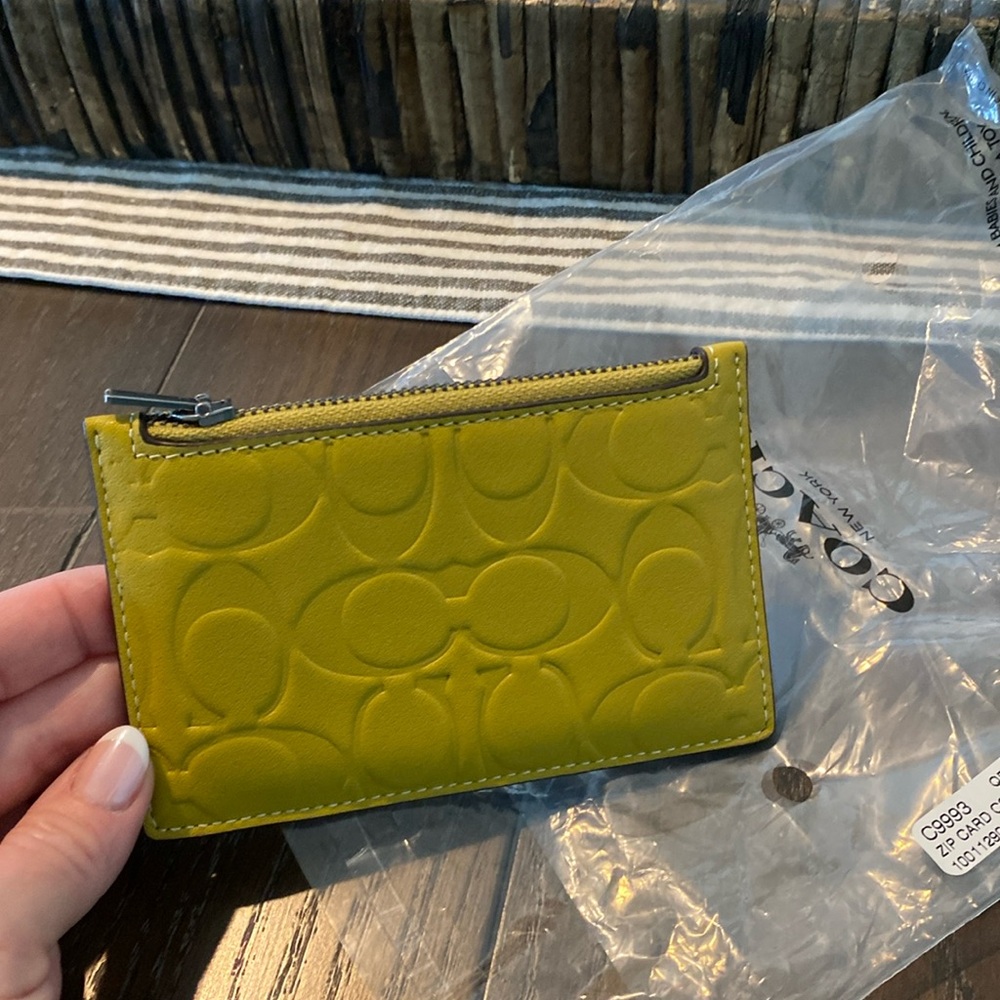 Coach zip card holder with signature leather. Brand new